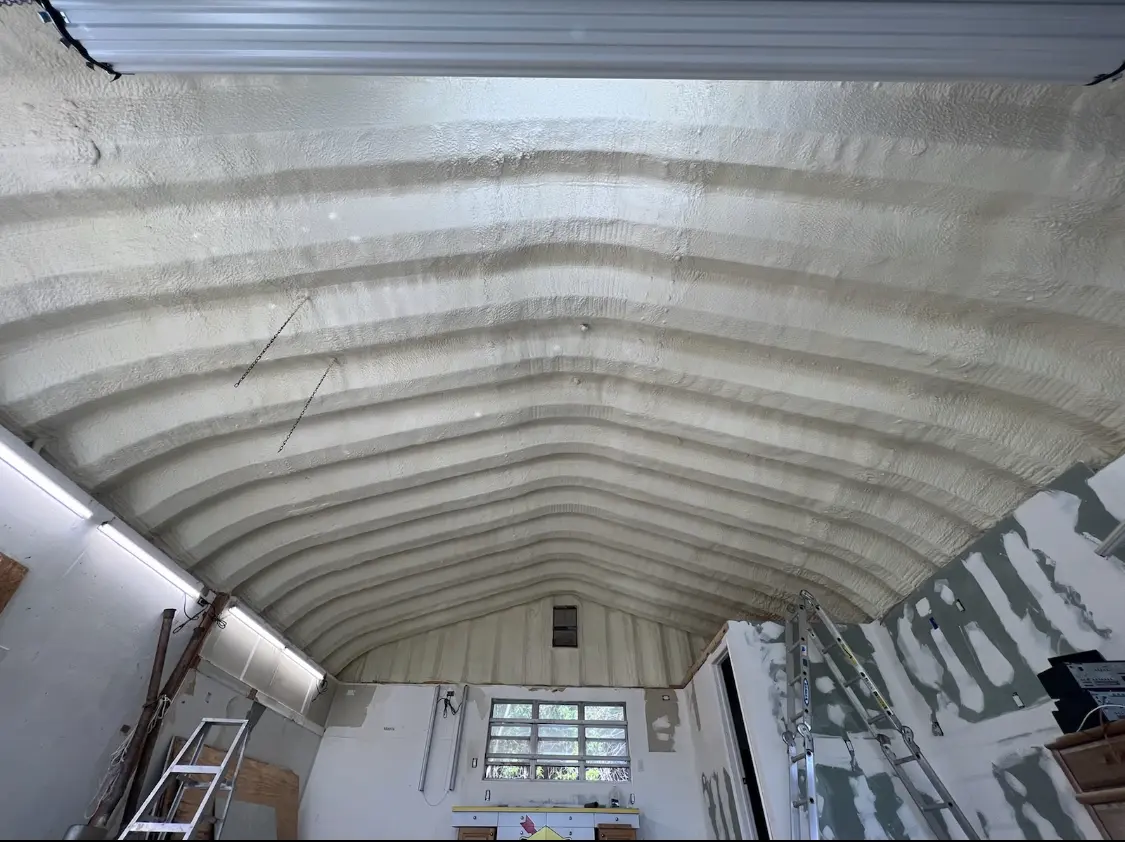 Spray polyurethane foam applied to the underside of a metal roof deck in Castroville